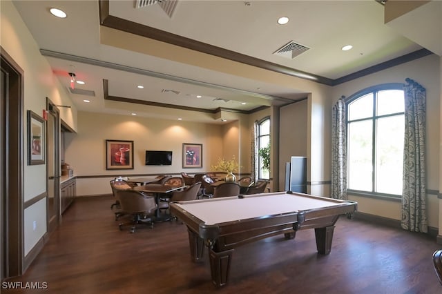 rec room featuring pool table, ornamental molding, a tray ceiling, and dark hardwood / wood-style flooring