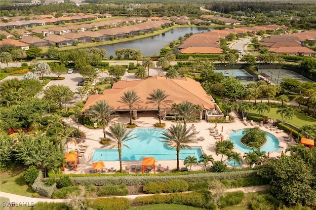 birds eye view of property with a water view