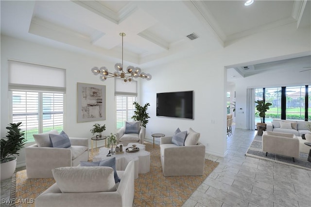 living room featuring beamed ceiling, ornamental molding, coffered ceiling, and a notable chandelier