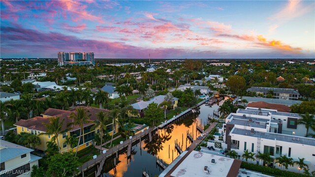 aerial view at dusk with a water view