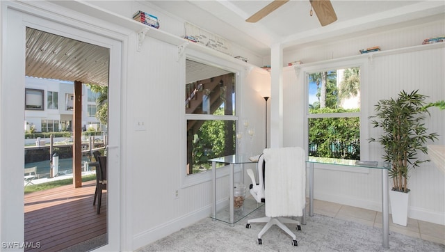 office space featuring light tile patterned floors and ceiling fan