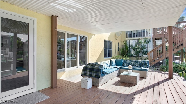 wooden terrace featuring an outdoor hangout area