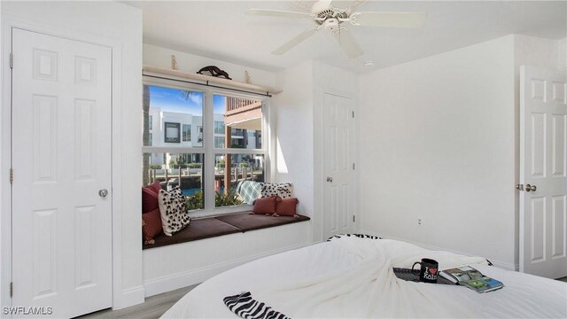 bedroom featuring light wood-type flooring and ceiling fan