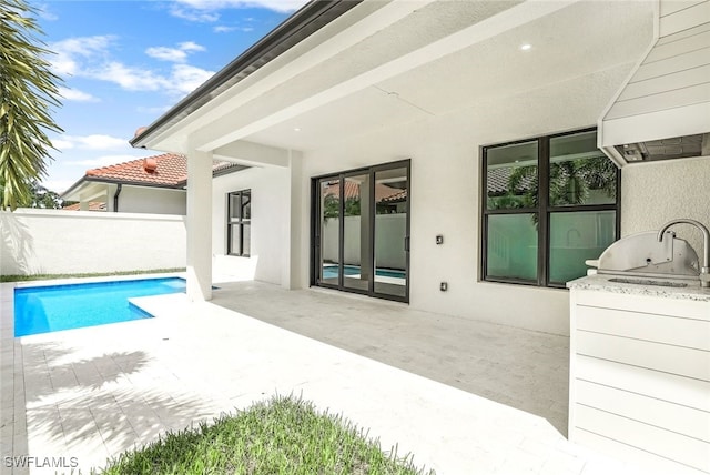 exterior space featuring area for grilling and a fenced in pool