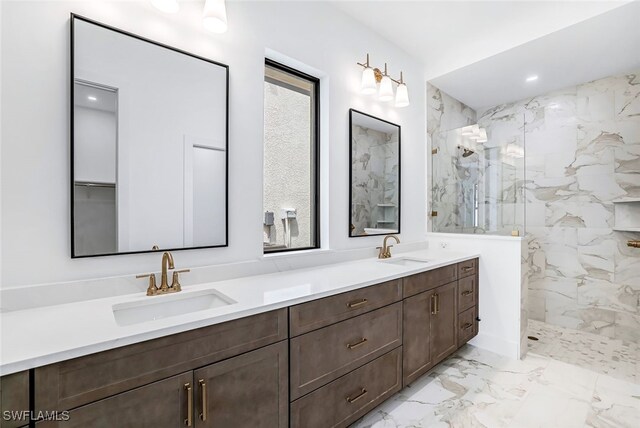 bathroom featuring vanity and tiled shower