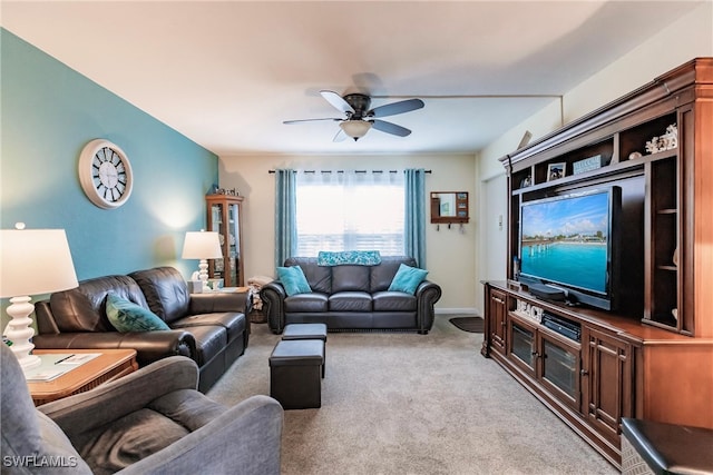 living room featuring ceiling fan and light colored carpet