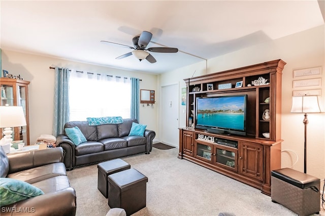 carpeted living room featuring ceiling fan