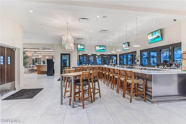 295 Grande Way Unit 1004, Naples, FL 34110 - dining room with a chandelier, light tile patterned flooring, and recessed lighting