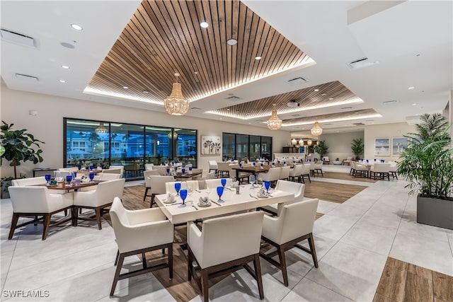 dining space featuring visible vents, recessed lighting, light tile patterned floors, a raised ceiling, and wood ceiling