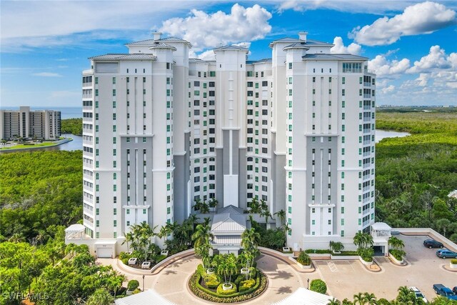 295 Grande Way Unit 1004, Naples, FL 34110 - view of building exterior featuring a water view