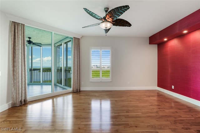 295 Grande Way Unit 1004, Naples, FL 34110 - spare room with ceiling fan and wood finished floors