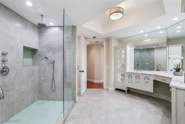 295 Grande Way Unit 1004, Naples, FL 34110 - bathroom featuring vanity, tiled shower, and recessed lighting