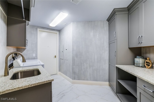 295 Grande Way Unit 1004, Naples, FL 34110 - washroom featuring cabinet space and light marble finish flooring