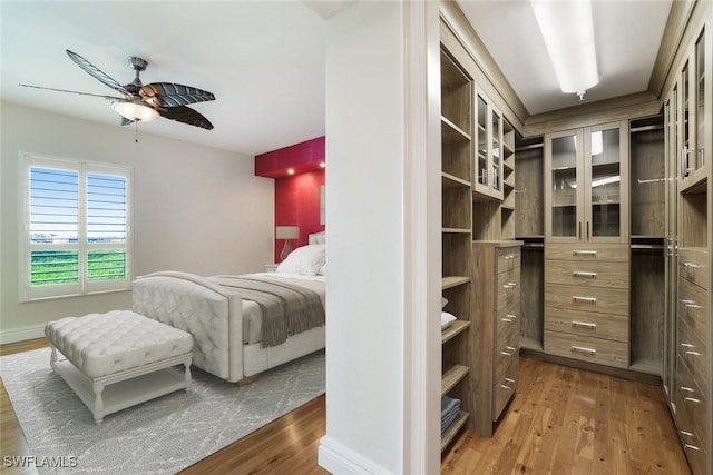 bedroom with ceiling fan and dark hardwood / wood-style flooring