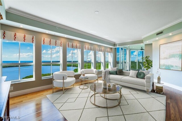 295 Grande Way Unit 1004, Naples, FL 34110 - sunroom / solarium with ornamental molding, wood finished floors, a water view, and recessed lighting