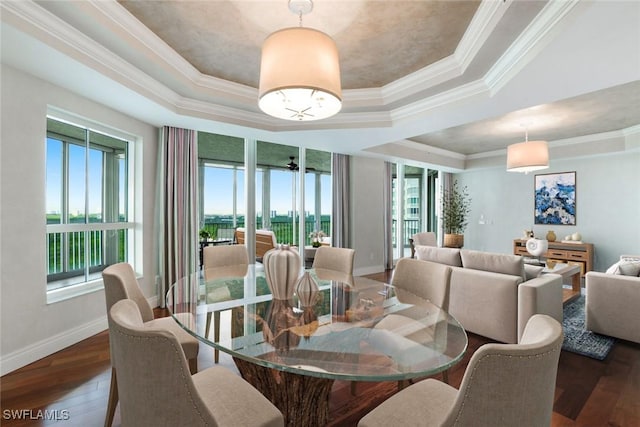 295 Grande Way Unit 1004, Naples, FL 34110 - dining room featuring a tray ceiling, wood-type flooring, and ornamental molding