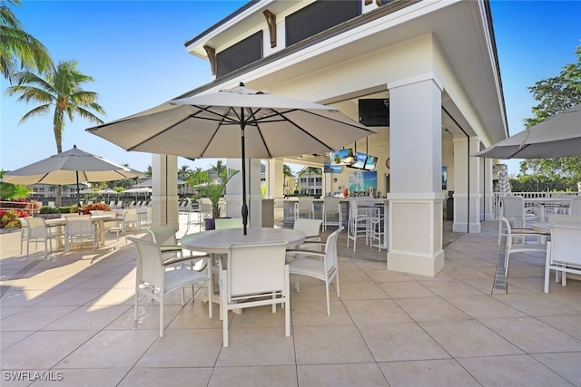 295 Grande Way Unit 1004, Naples, FL 34110 - view of patio / terrace with outdoor dining area