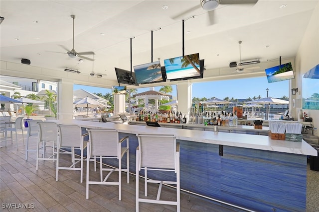 view of patio / terrace featuring outdoor dry bar and ceiling fan