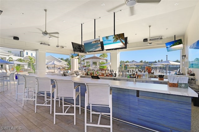 295 Grande Way Unit 1004, Naples, FL 34110 - view of patio featuring an outdoor bar and a ceiling fan
