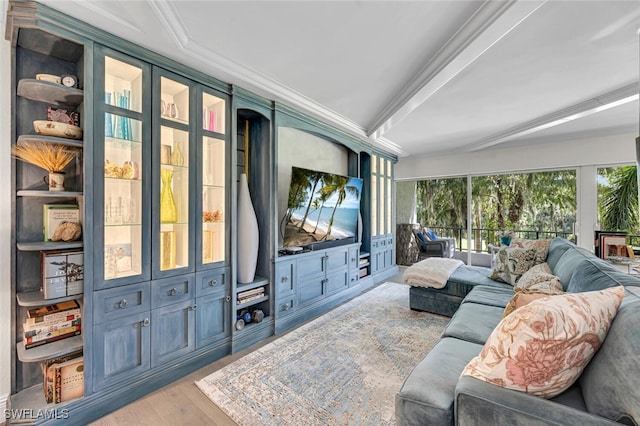 living room with light wood-type flooring and ornamental molding