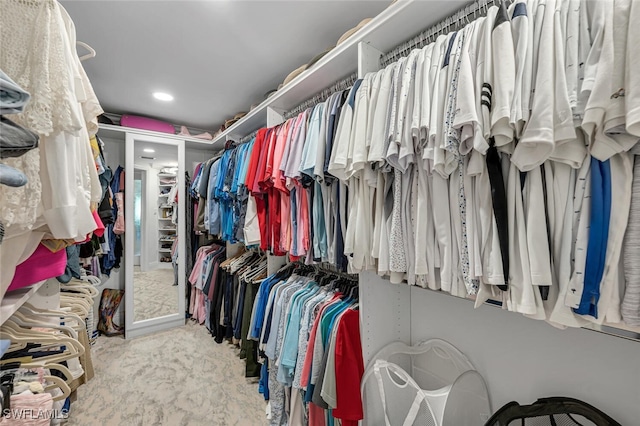 spacious closet featuring carpet floors