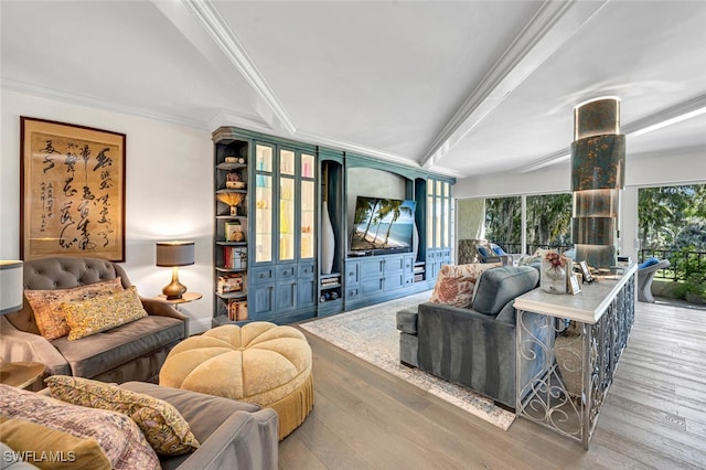 living room with light hardwood / wood-style flooring, ornamental molding, and a healthy amount of sunlight