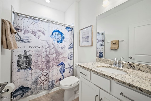 full bathroom featuring tile patterned flooring, vanity, and toilet