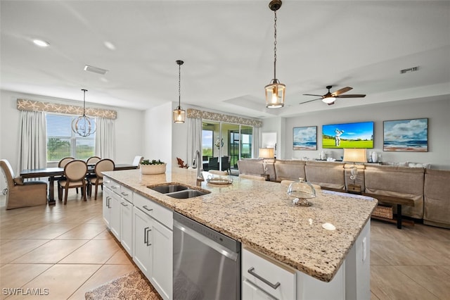 kitchen featuring visible vents, white cabinets, open floor plan, stainless steel dishwasher, and a sink