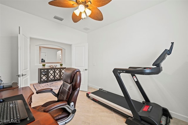 office area featuring light tile patterned floors, ceiling fan, visible vents, and baseboards