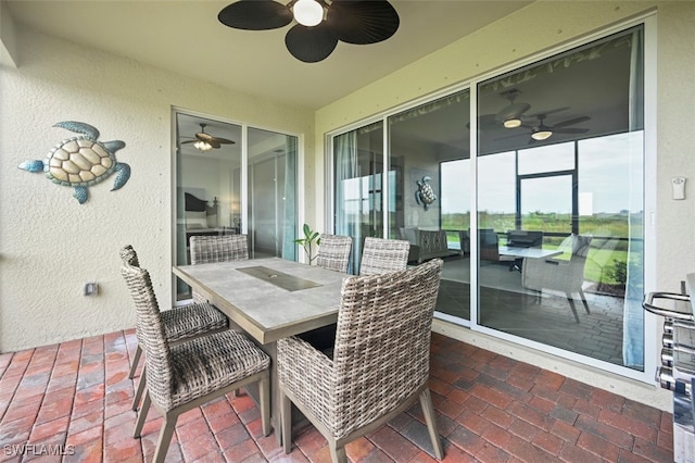 view of patio featuring outdoor dining area and ceiling fan