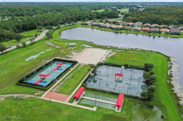 aerial view with a forest view and a water view