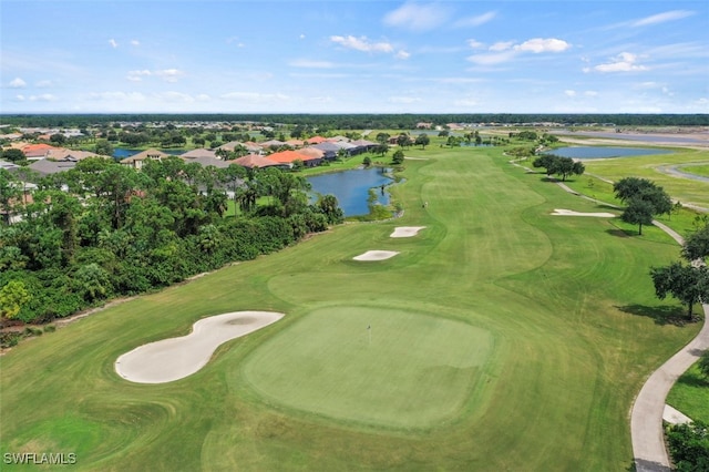 aerial view with view of golf course and a water view