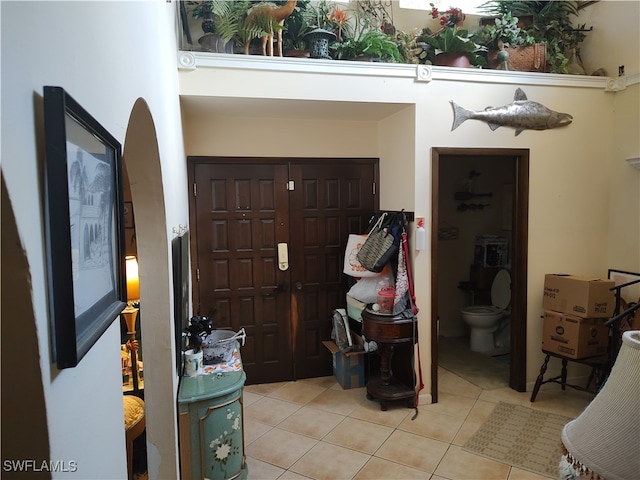 foyer featuring light tile patterned flooring