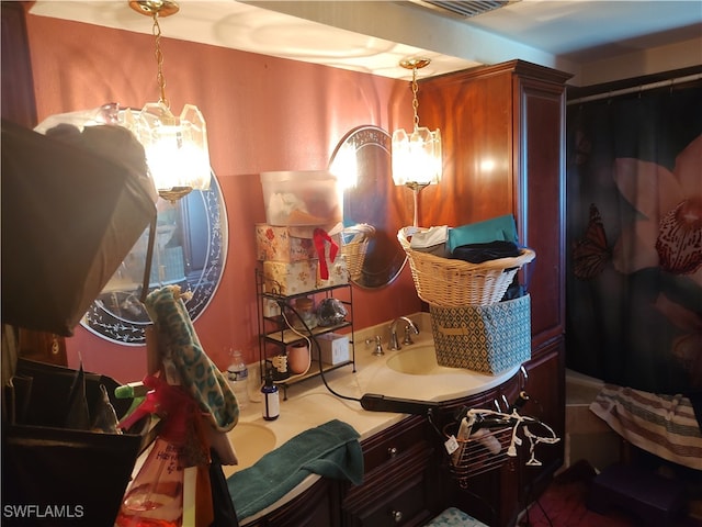 interior space featuring an inviting chandelier and sink