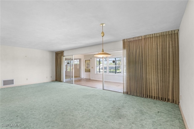 unfurnished living room featuring carpet floors