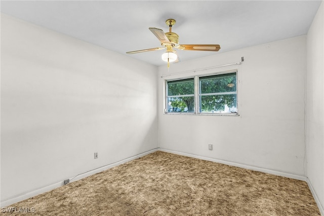 empty room featuring carpet floors and ceiling fan