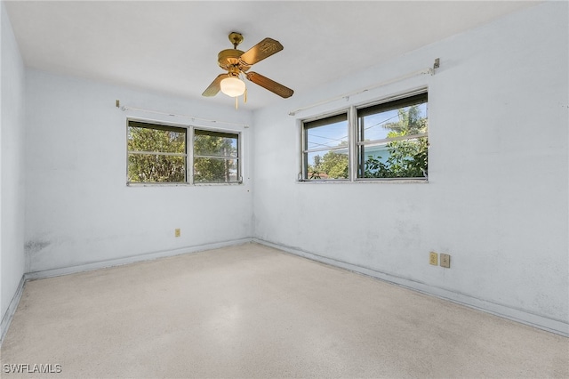 unfurnished room with ceiling fan