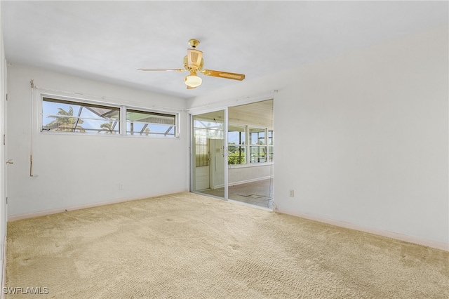 carpeted empty room with ceiling fan