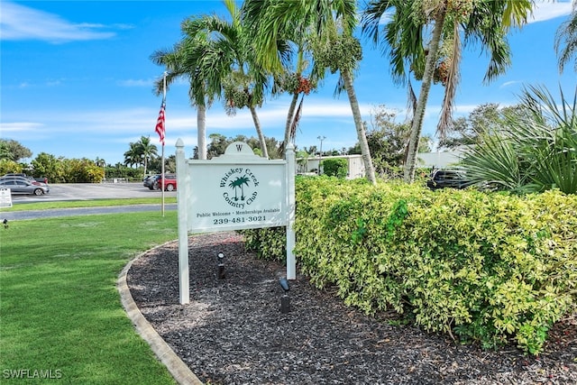 community sign with a lawn