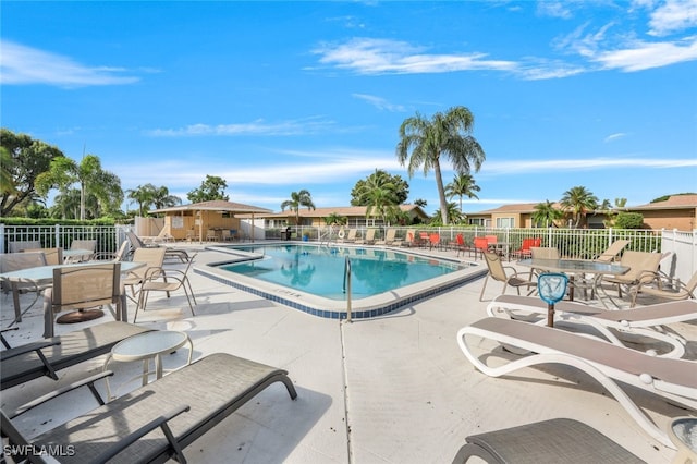 view of swimming pool with a patio