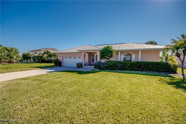 ranch-style house featuring a front lawn and a garage