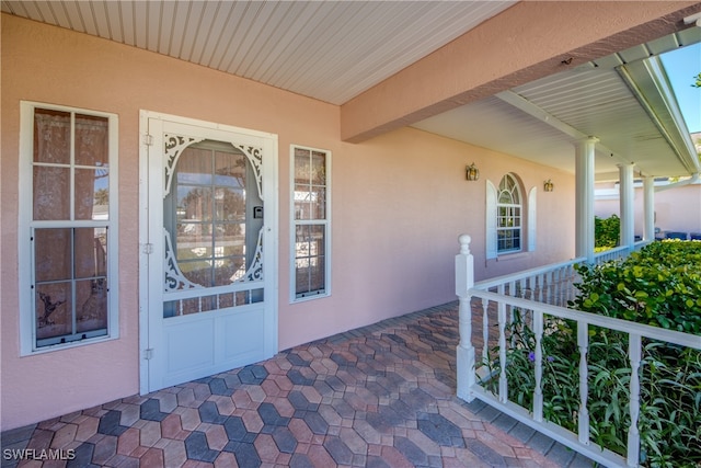 property entrance with covered porch