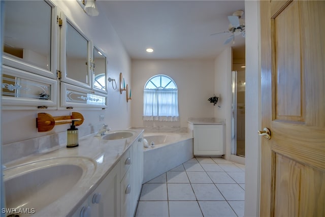 bathroom with shower with separate bathtub, vanity, ceiling fan, and tile patterned floors