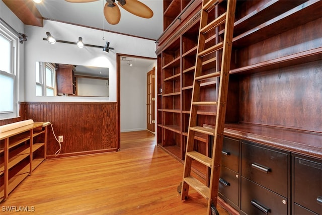 interior space with light hardwood / wood-style floors and ceiling fan