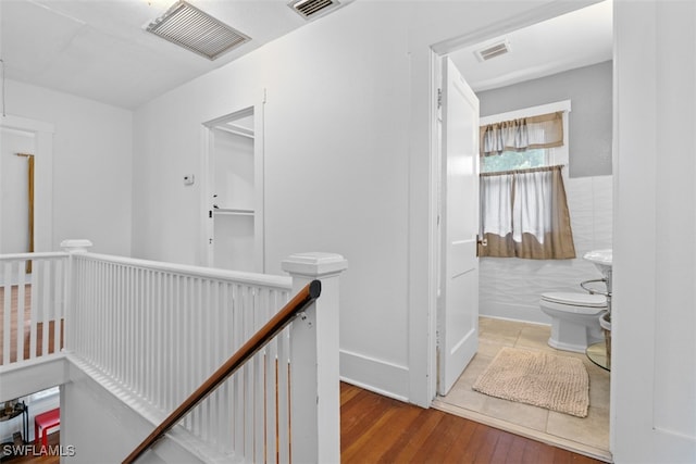 corridor featuring hardwood / wood-style floors