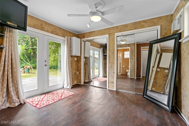 entryway with dark wood-type flooring, ceiling fan, and french doors