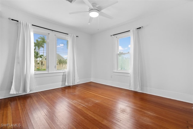 spare room with wood-type flooring and ceiling fan