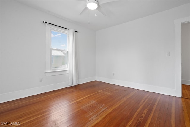 spare room featuring ceiling fan and hardwood / wood-style flooring