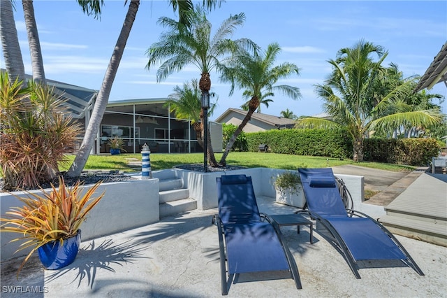 view of patio / terrace with a sunroom