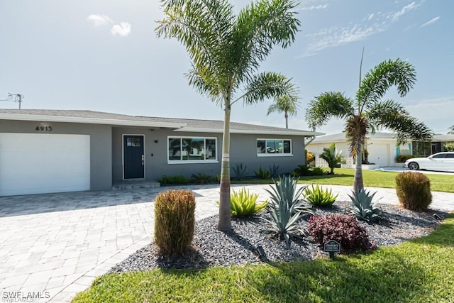 single story home featuring a garage